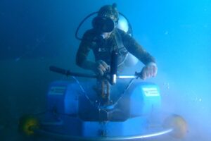 TSS diver operating the Piccard Brush-Kart during an underwater hull cleaning