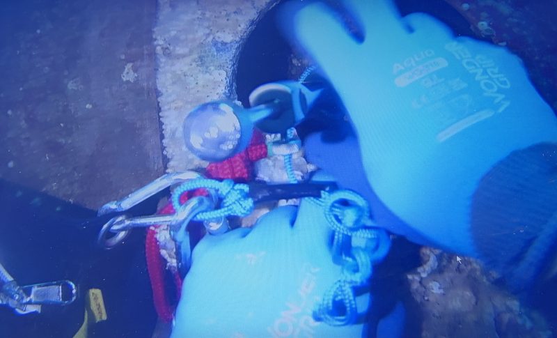 Diver securing an underwater blanking fitting